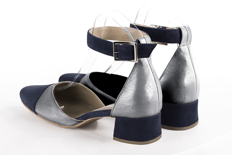 Navy blue and dove grey women's open side shoes, with a strap around the ankle. Round toe. Low flare heels. Rear view - Florence KOOIJMAN